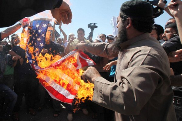 September 14, protestors in Amman, Jordan burn the American flag in revolt of an American-made YouTube video mocking the Prophet