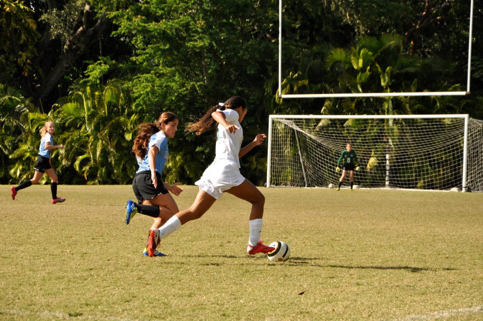 Jordyn Elliot dribbles the ball toward the goal.