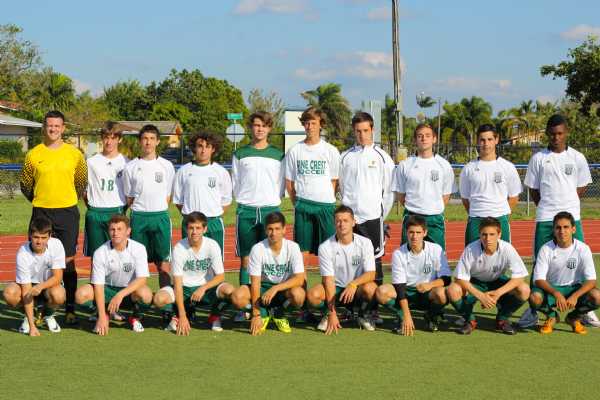 The Pine Crest Boy's Soccer Team poses for a team photo.