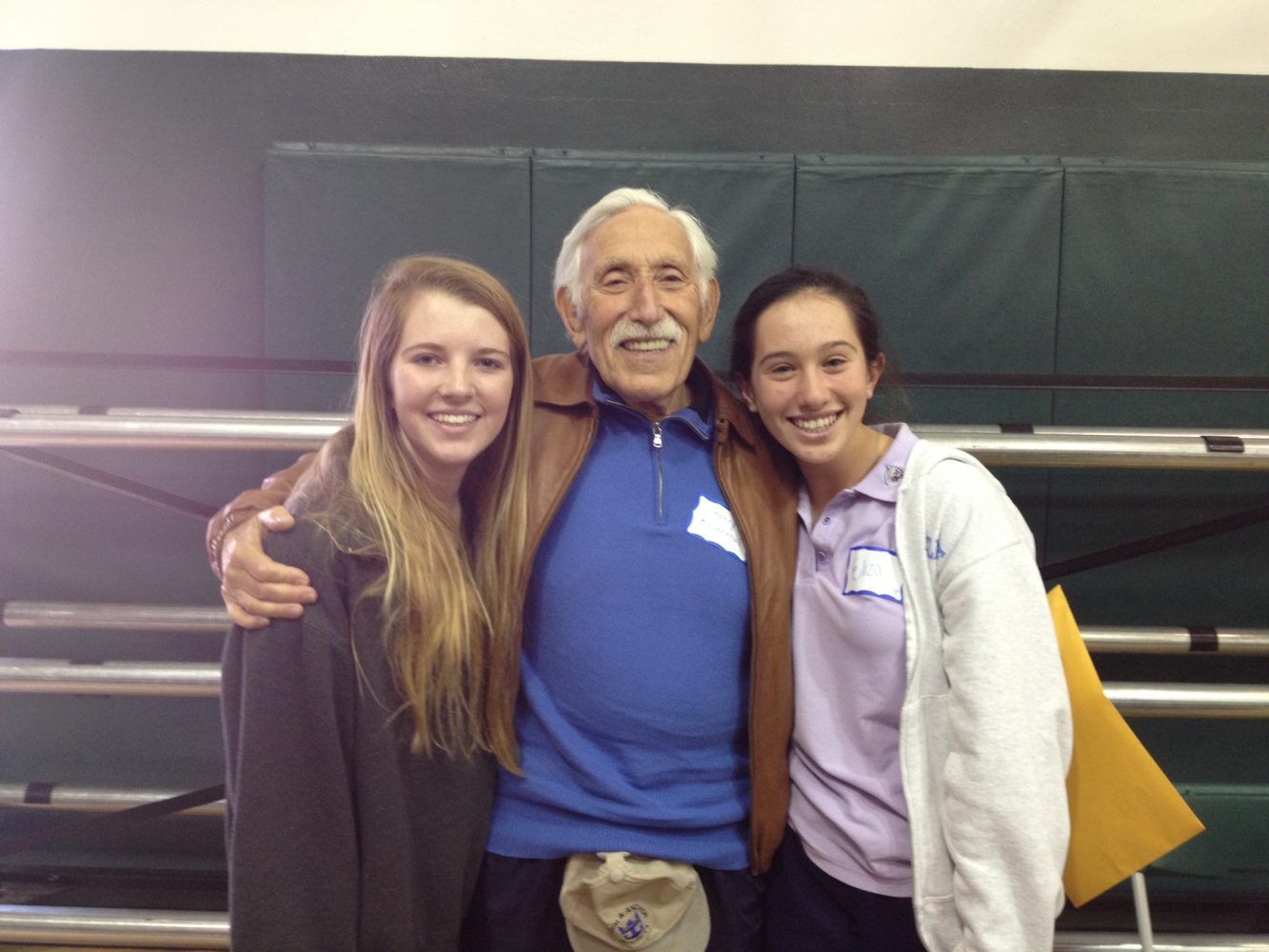 Eliza Moldow and Kayla Mitchell spending time with Holocaust survivor Mr. Henry Rosenthal. 