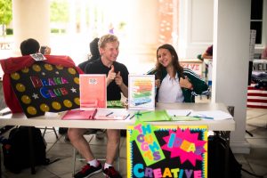 Students running a booth at the Club Fair. 