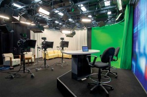 The new PCTV studio is equipped with a green screen, twelve Apple computers, an anchor desk, quality sound and light systems, and much more!