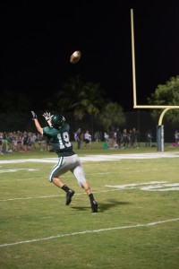 Senior Wide Receiver, Austin Litofsky, reaches out for a deep pass thrown by Sophomore Quarterback Zach Smith, during the final home game of his Pine Crest career. The Panthers played hard but ultimately lost 41-14 to the Benjamin Buccaneers. 