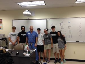 Dr. Lubetkin poses with PC Pre Med Club students following his lecture. Source: Kyle Ockerman
