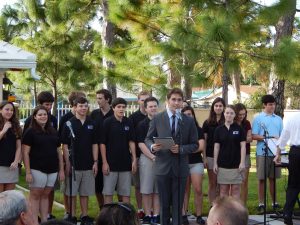 Upper School President, Loius Browne, introducing the PC Singers.  Photo: Christine Dardet