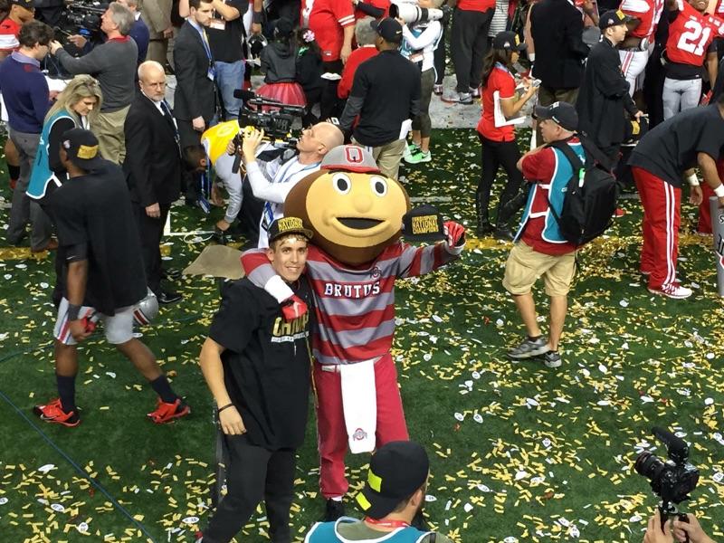 Former Pine Crest student Mike Cibene (2012), poses with Ohio State mascot, Brutus the Buckeye after Ohio State beat Oregon 42-20 to win the inaugural College Football Playoff. 