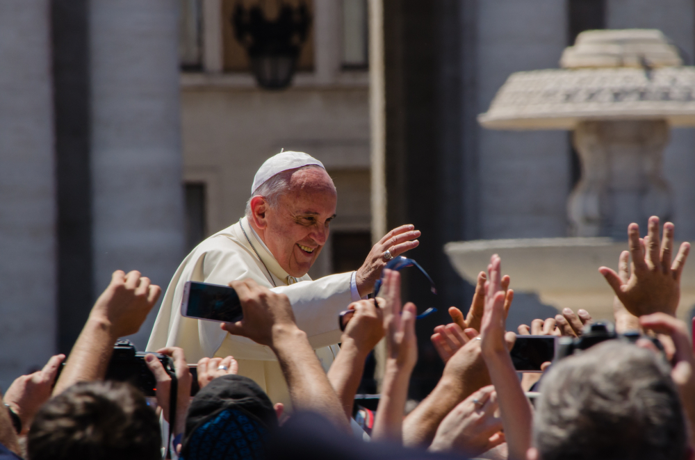 Pope Francis waves to a crowd