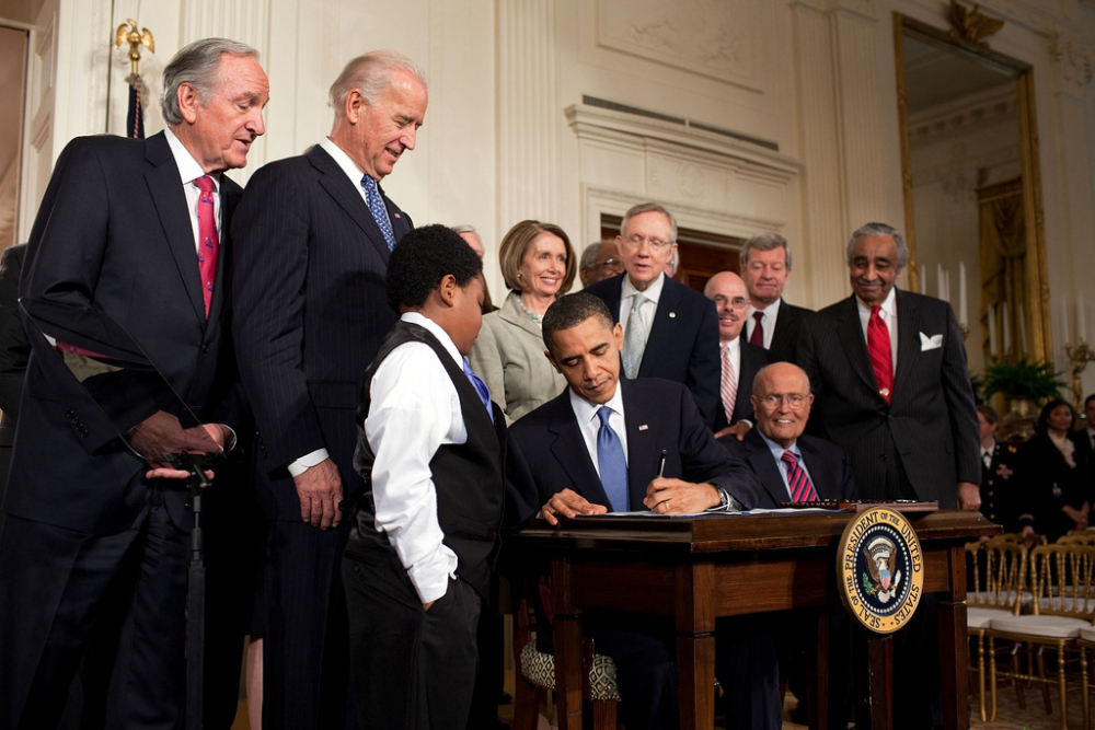 Seen here is President Obama signing the ACA which Republicans were unable to repeal this week. (Flickr/Pete Souza)
