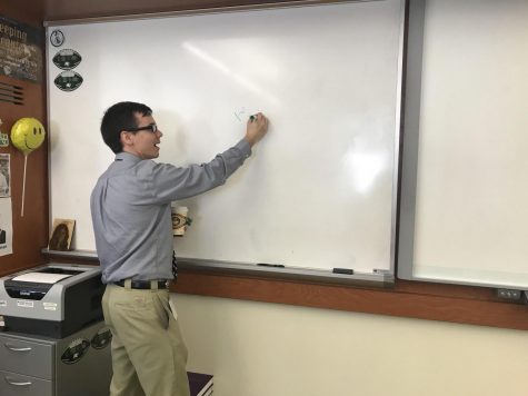 Mr. Lowe hard at work during an important math lesson.