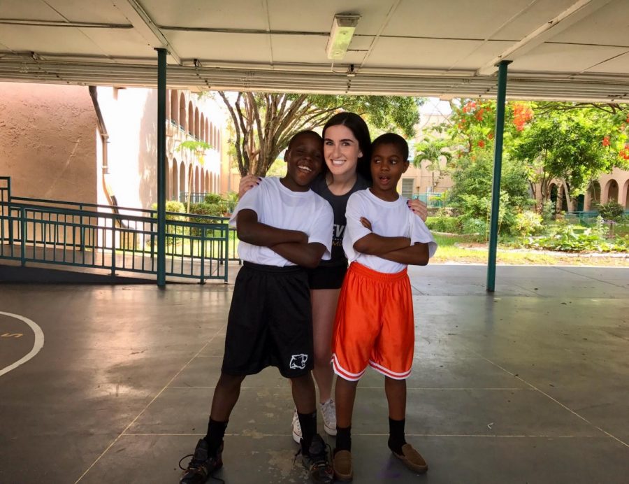 Julia spends time with two of her buddies at Achieve Miami. 
