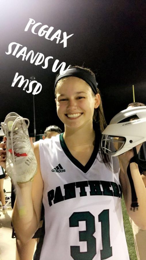 Senior Caroline Adkins supports MSD with a red ribbon on her cleat