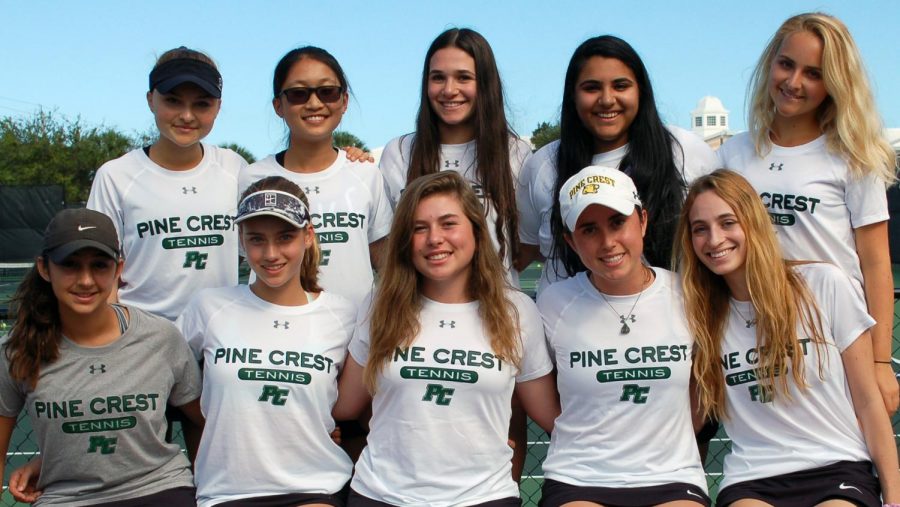 The Girls Varsity Tennis Team smiling big after advancing to Regional Semi-Final. 