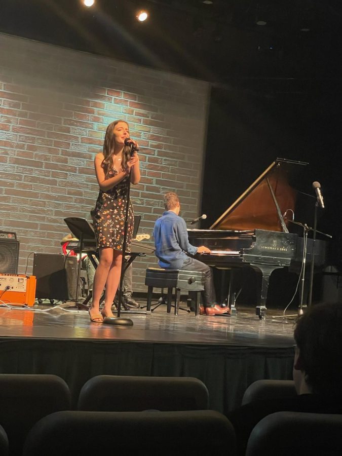 Greer Udelson 23 sings at the fall Playing for Change.