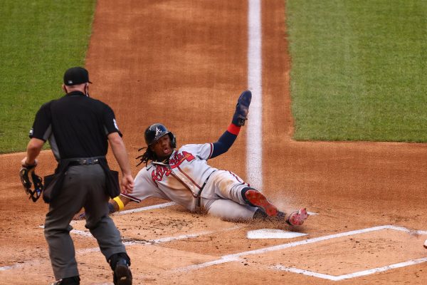 Outfielder Ronald Acuña Jr, NL MVP frontrunner, slides into home plate