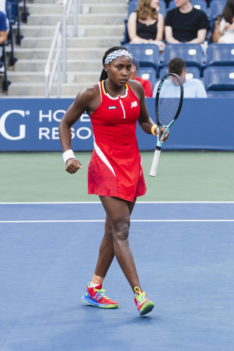 Coco Gauff walks across the court at the US Open